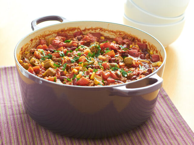 Enameled cast iron pot filled with a hot meal